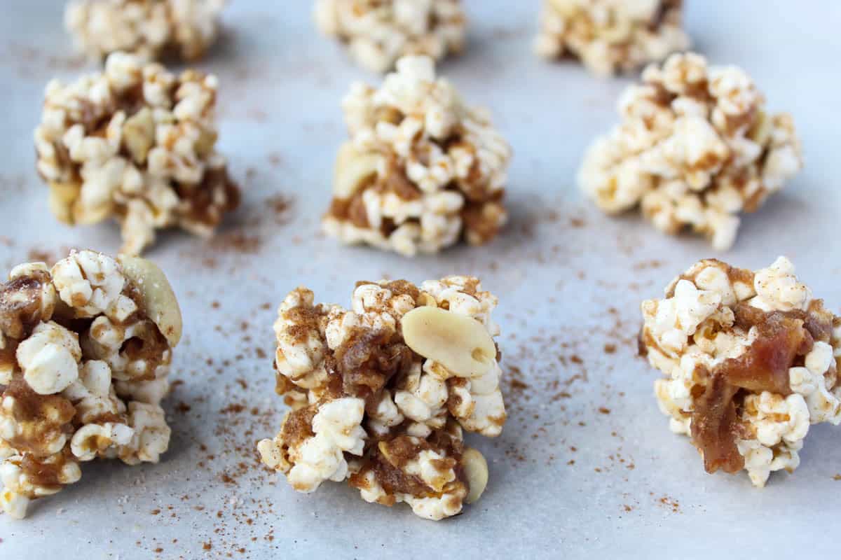 No bake and 30 minutes to make, these Peanut Butter Caramel Popcorn Balls are the perfect holiday snack. No added sweetener, vegan, and gluten free! - Eat the Gains