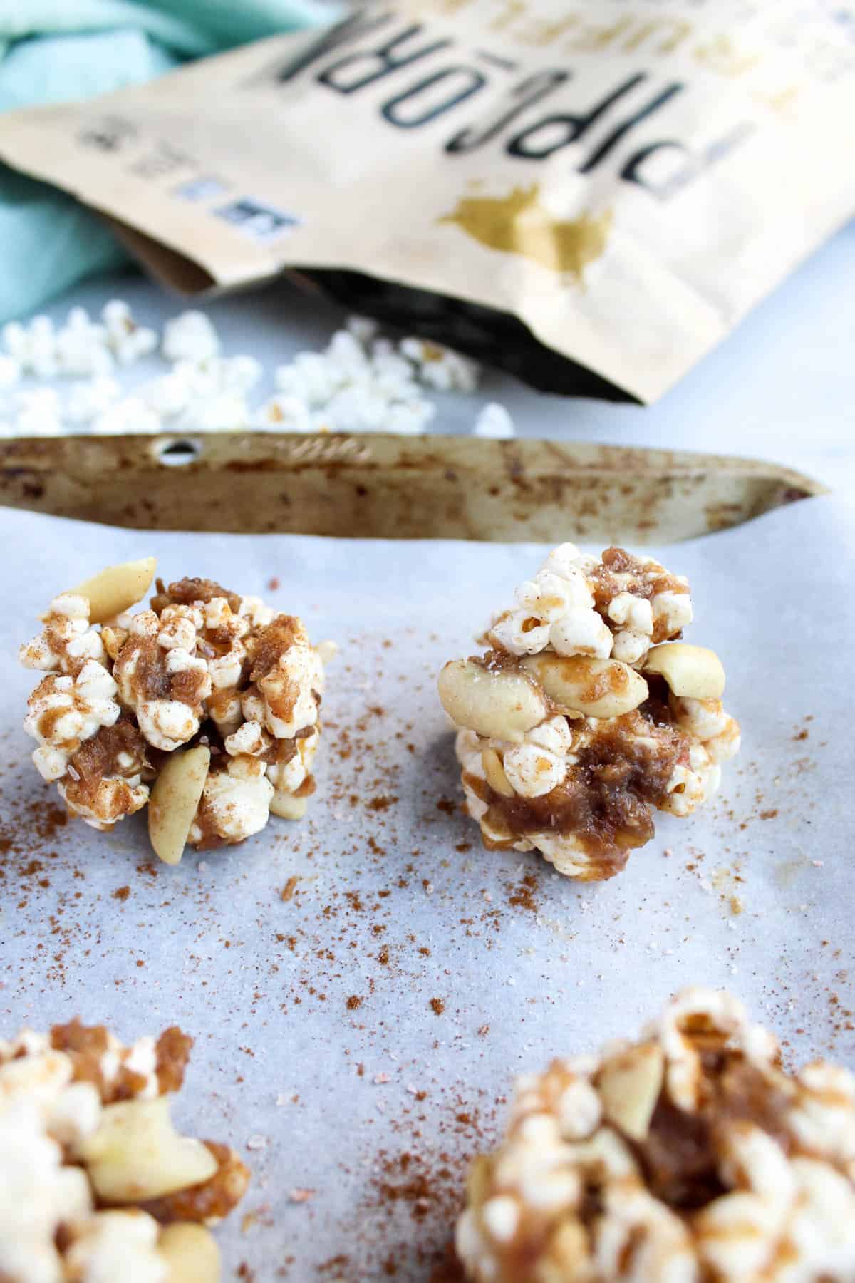 No bake and 30 minutes to make, these Peanut Butter Caramel Popcorn Balls are the perfect holiday snack. No added sweetener, vegan, and gluten free! - Eat the Gains