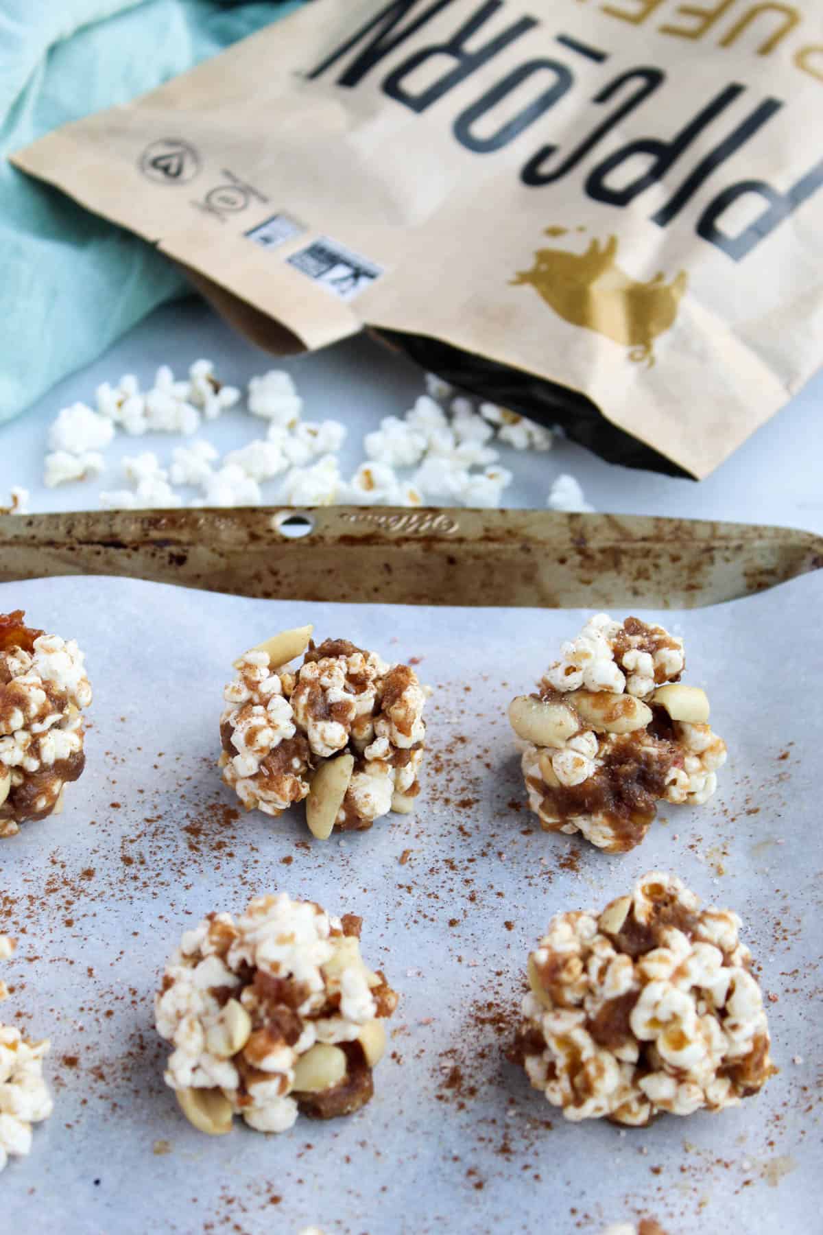 No bake and 30 minutes to make, these Peanut Butter Caramel Popcorn Balls are the perfect holiday snack. No added sweetener, vegan, and gluten free! - Eat the Gains