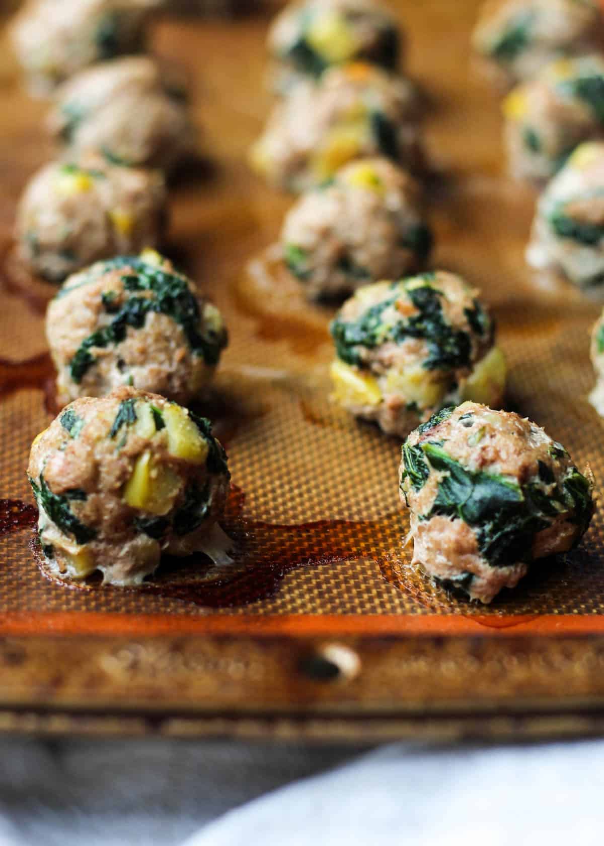 Protein, veggies, and fruit packed, these Turkey, Kale, & Apple Meatballs come together in less than 30 minutes and are paleo, gluten free, and Whole30 compliant! - Eat the Gains