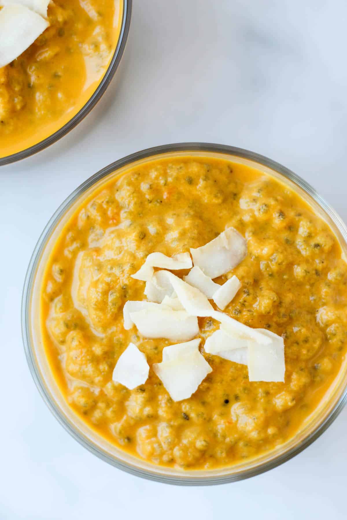 This Carrot Cake Chia Pudding takes the flavors of a classic dessert and turns it into a healthy snack that is paleo, vegan, and dairy & gluten free - Eat the Gains