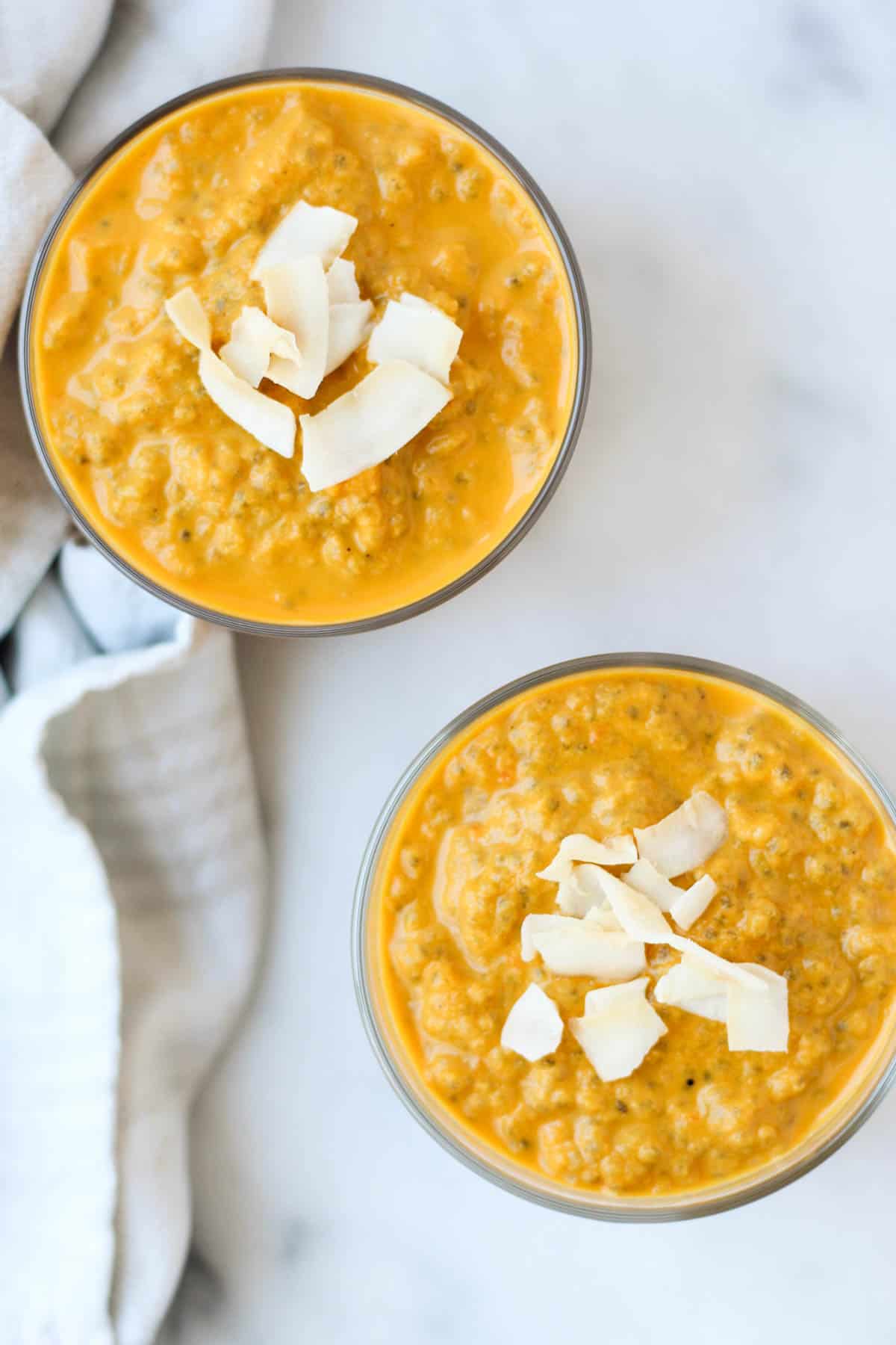 This Carrot Cake Chia Pudding takes the flavors of a classic dessert and turns it into a healthy snack that is paleo, vegan, and dairy & gluten free - Eat the Gains