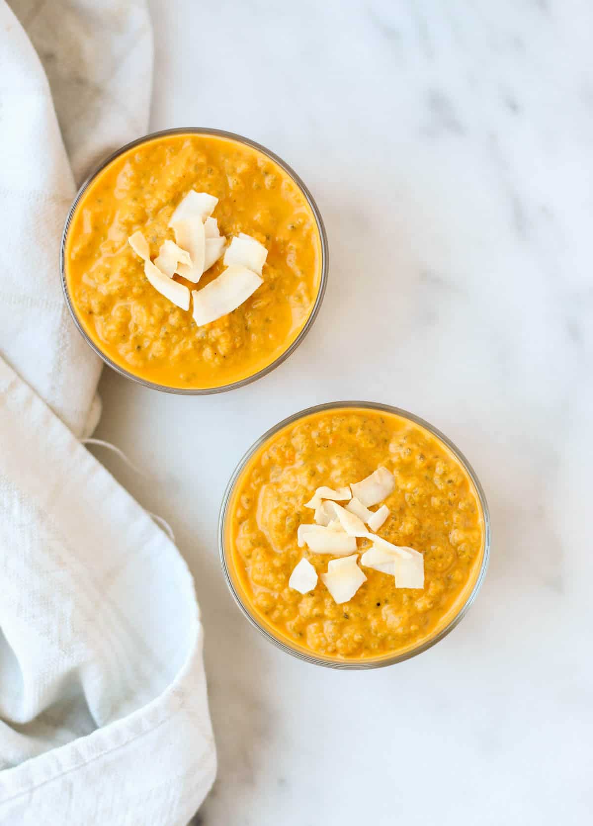 This Carrot Cake Chia Pudding takes the flavors of a classic dessert and turns it into a healthy snack that is paleo, vegan, and dairy & gluten free - Eat the Gains