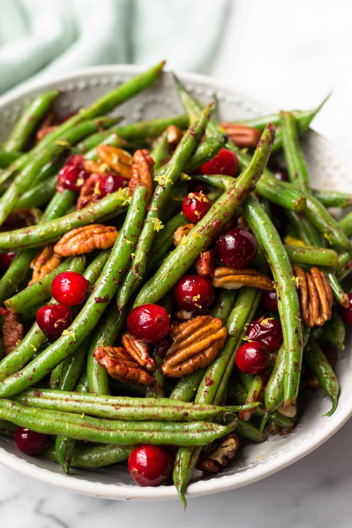 These super easy Paleo Holiday Green Beans come together in less than 10 minutes and make the perfect side to your main course - paleo, vegan, and Whole30 approved too! - Eat the Gains