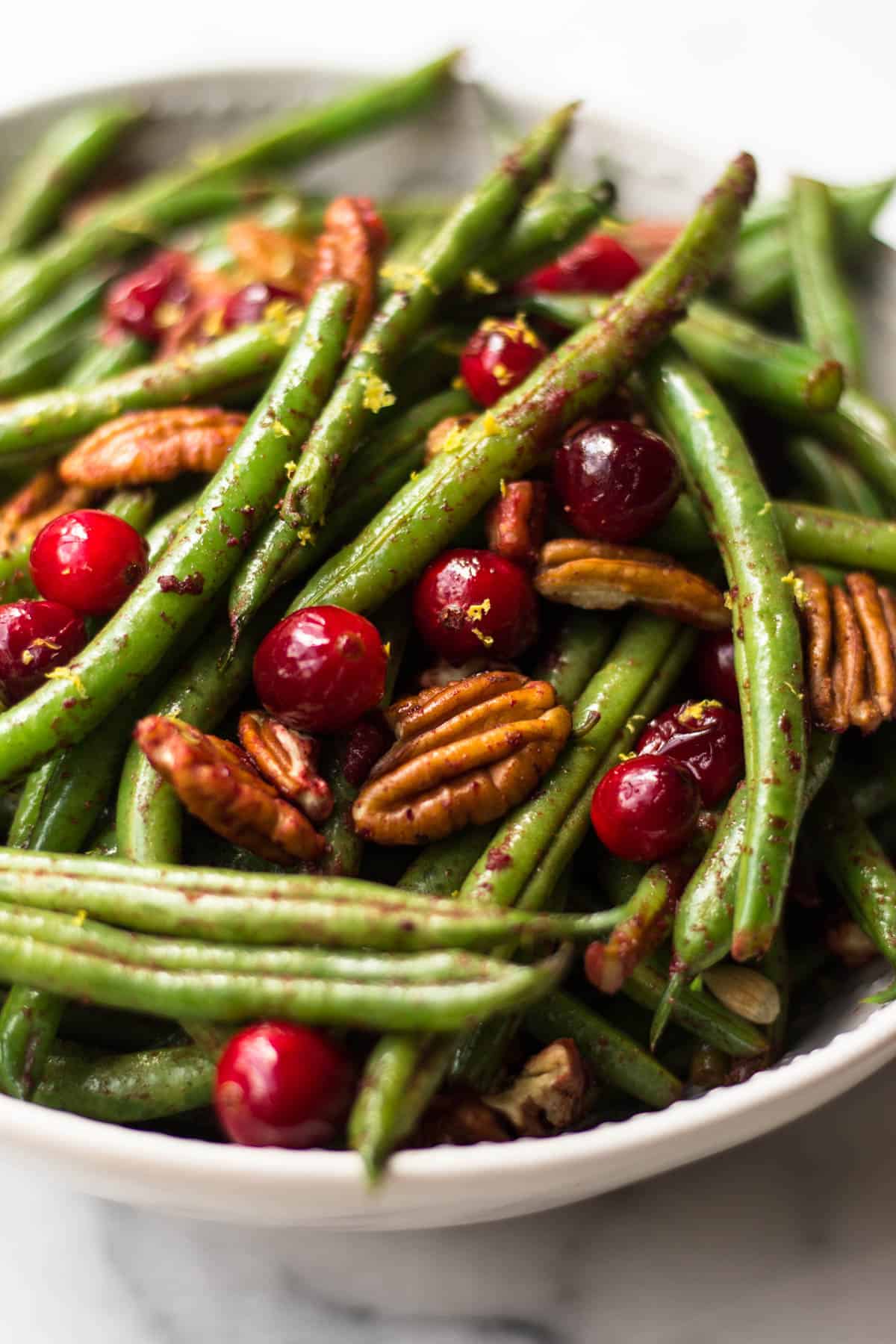 These super easy Paleo Holiday Green Beans come together in less than 10 minutes and make the perfect side to your main course - paleo, vegan, and Whole30 approved too! - Eat the Gains