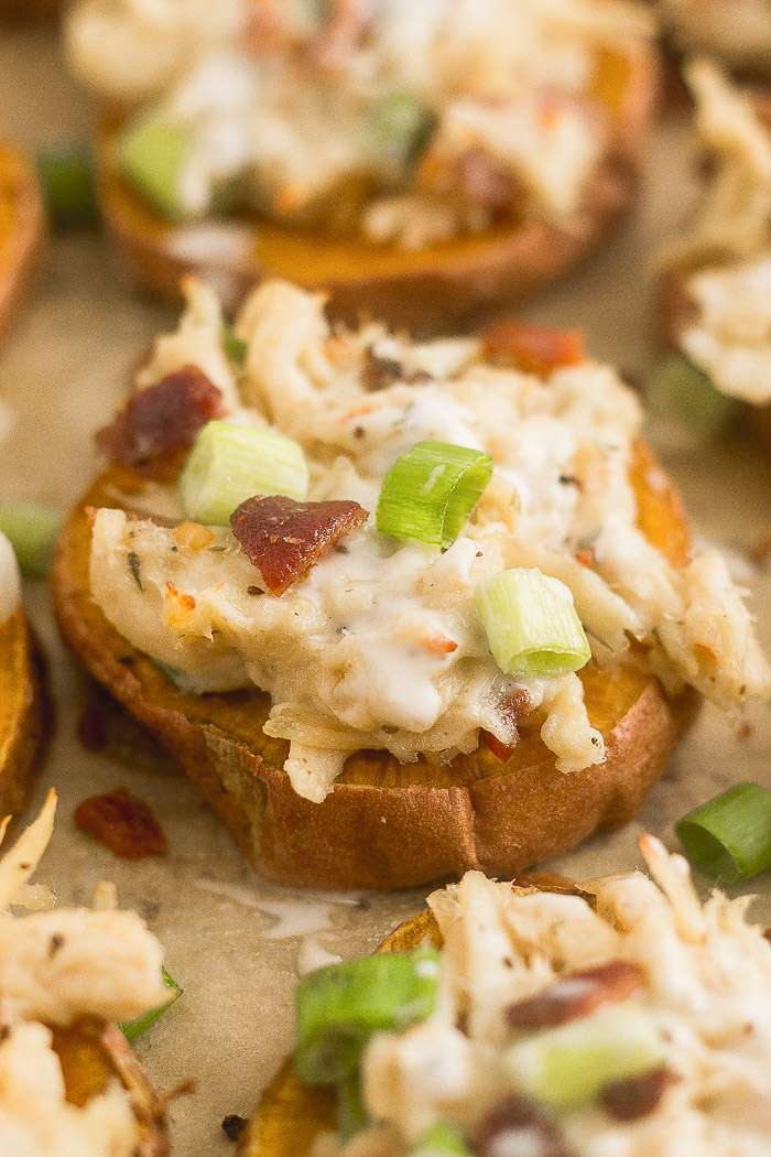 Individual chicken bacon ranch pizza on a baking sheet.
