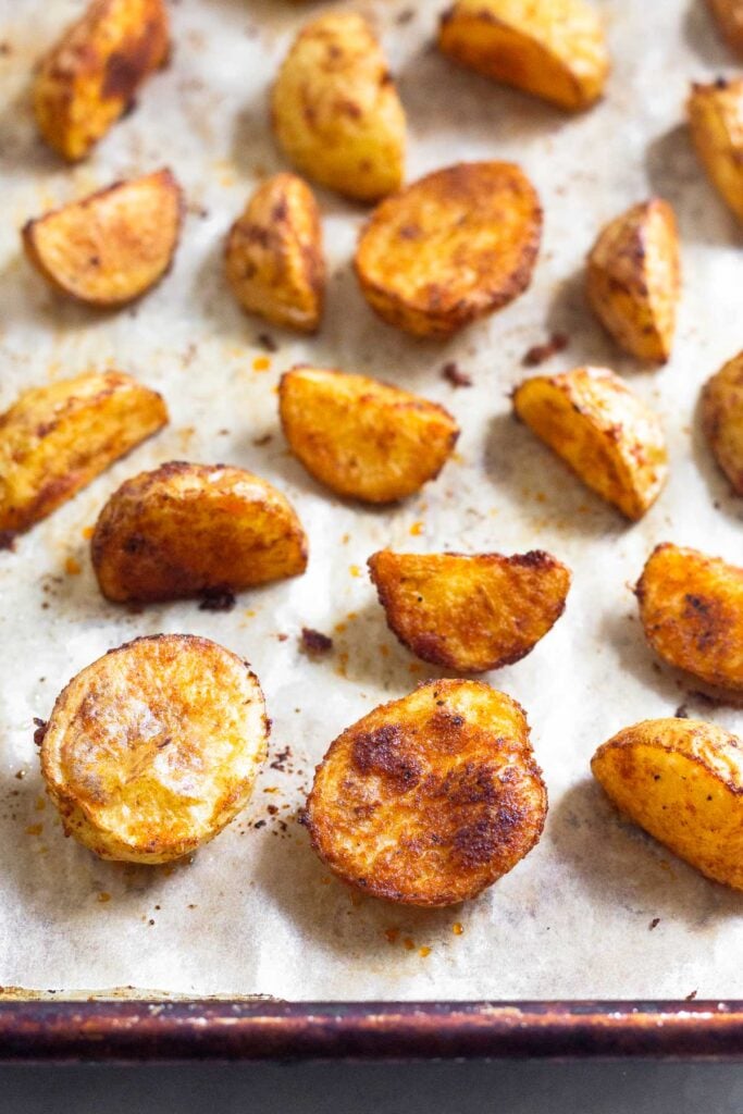 A sheet pan filled with roasted potatoes.