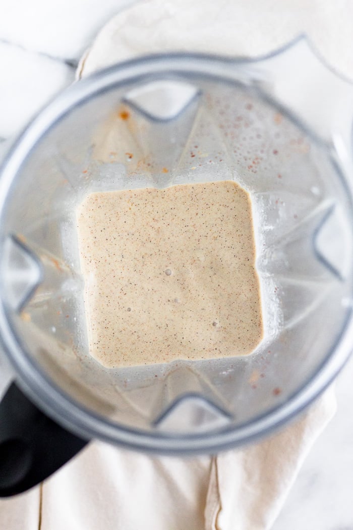 Blender filled with a homemade tahini milkshake.