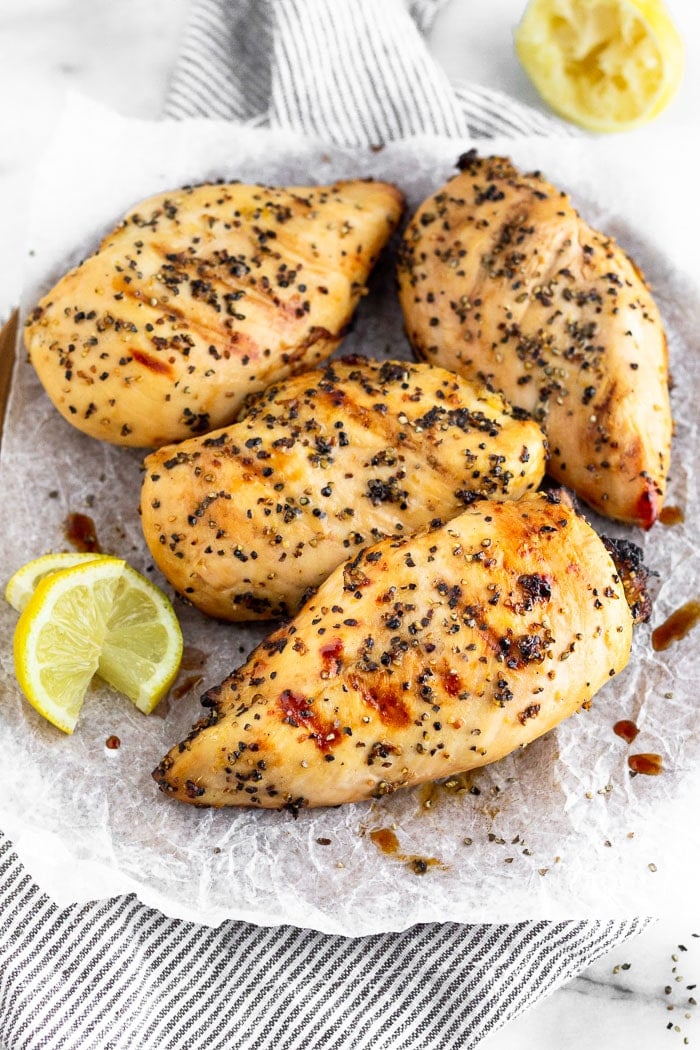 Plate of grilled chicken breasts.