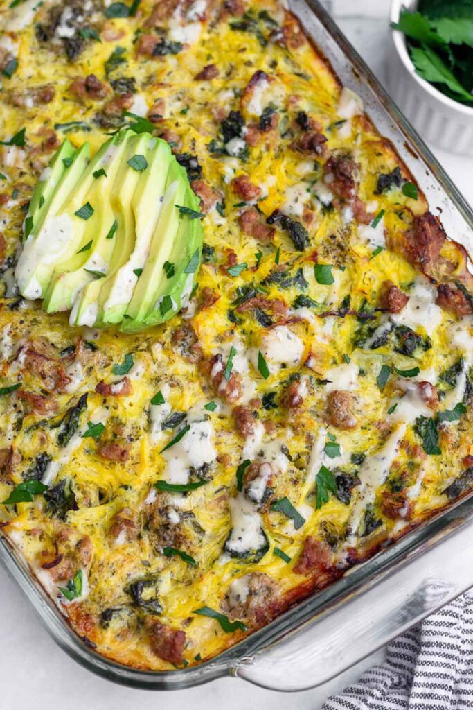 Healthy ground turkey casserole recipe with spaghetti squash and ranch. It is topped with avocado.